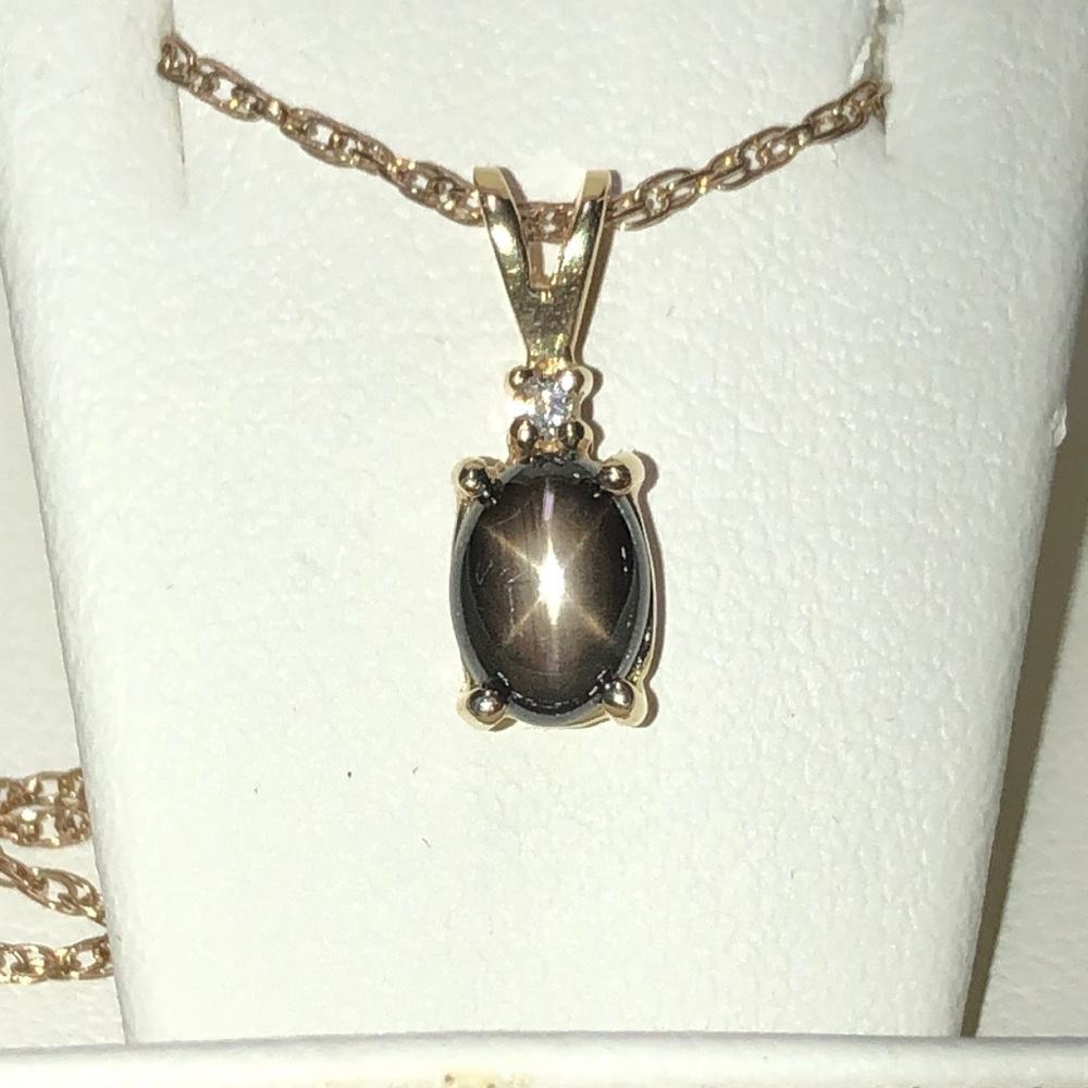 Black star sapphire and diamond, gold necklace